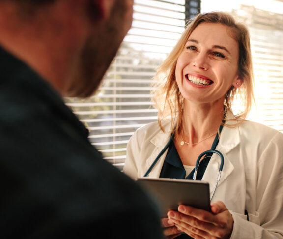 Friendly doctor interacting with her patient