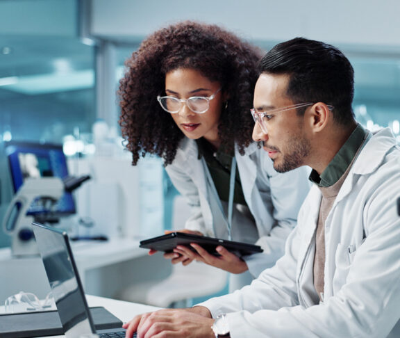 Science, teamwork and scientist with tablet in laboratory for communication, pharmaceutical review or planning. Employees, collaboration and technology for research, discussion and digital analysis