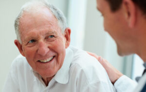 Male doctor discussing with his patient.