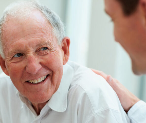 Male doctor discussing with his patient.