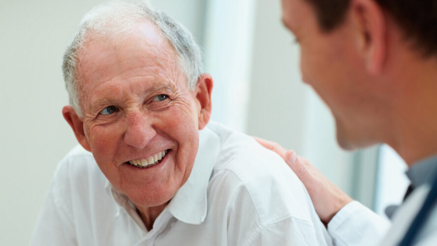Male doctor discussing with his patient.