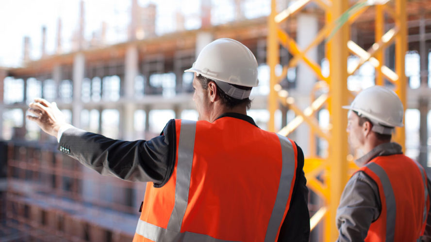 Construction workers working on construction site