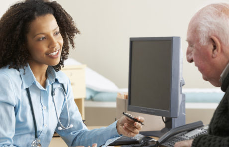 Young female Doctor with senior male patient