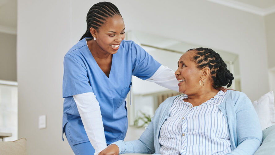 Nurse woman, senior patient and talking for support, healthcare and happiness at retirement home. Black person and happy caregiver together for trust, elderly care and help for health and wellness