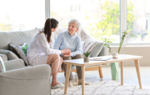 Doctor with senior woman in nursing home