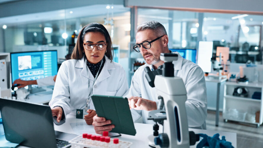 Collaboration, tablet or science with people in lab together for research or development. Innovation, tech and microscope with scientist team in clinical trial for planning or medical investigation