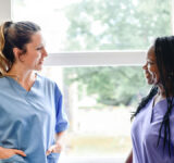 Nurses having a conversation in the hospital hallway